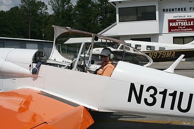 Elizabeth sits in the rear seat of Bob Goodman's experimental aircraft.