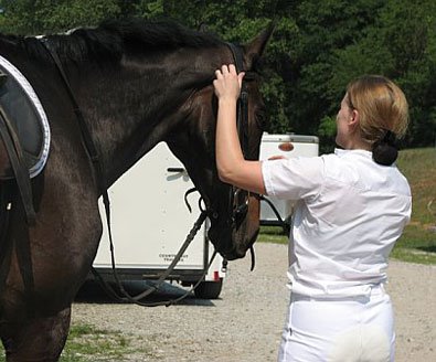 Paula and OTTB - Joe Bear get ready to compete in dressage.