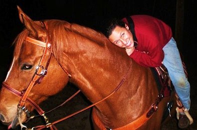 Light Artillery has his tongue out during a night ride with Amanada.