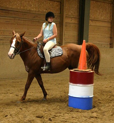 Katie at horse camp in her new outfit. 