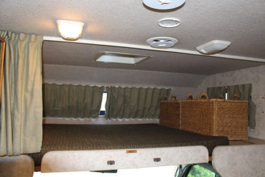 Large sleeping area over front seats
